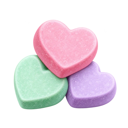 Three overlapping candy hearts in pink, mint green and lavender have softly textured surfaces.